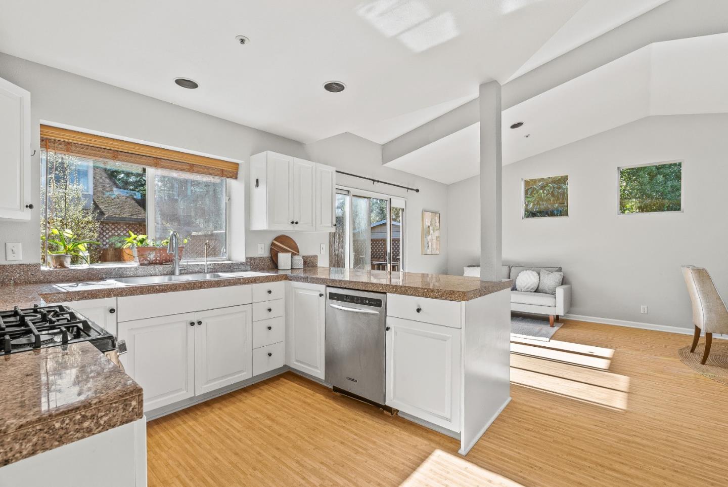 3200 Axford Road Santa Cruz, CA 95062 - Photo 22 of 45 a open kitchen with stainless steel appliances granite countertop a sink and cabinets with wooden floor