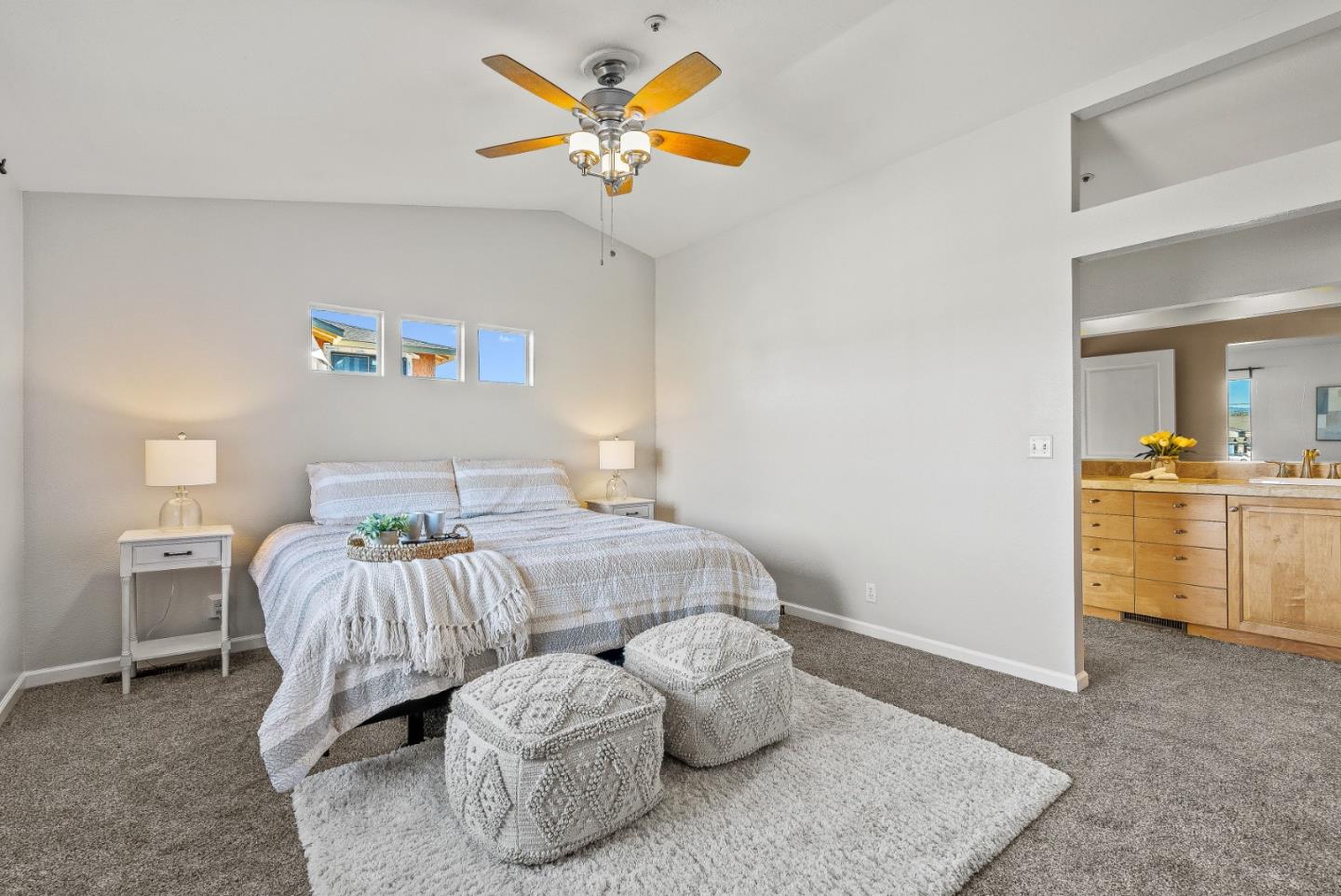 3200 Axford Road Santa Cruz, CA 95062 - Photo 31 of 45 a bedroom with a bed and a chandelier