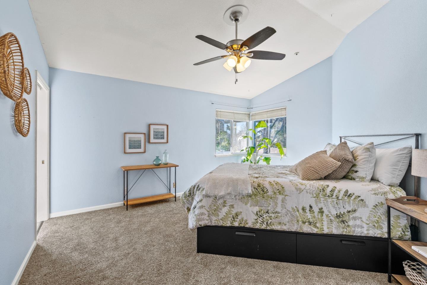 3200 Axford Road Santa Cruz, CA 95062 - Photo 34 of 45 a bedroom with a large bed and a chandelier