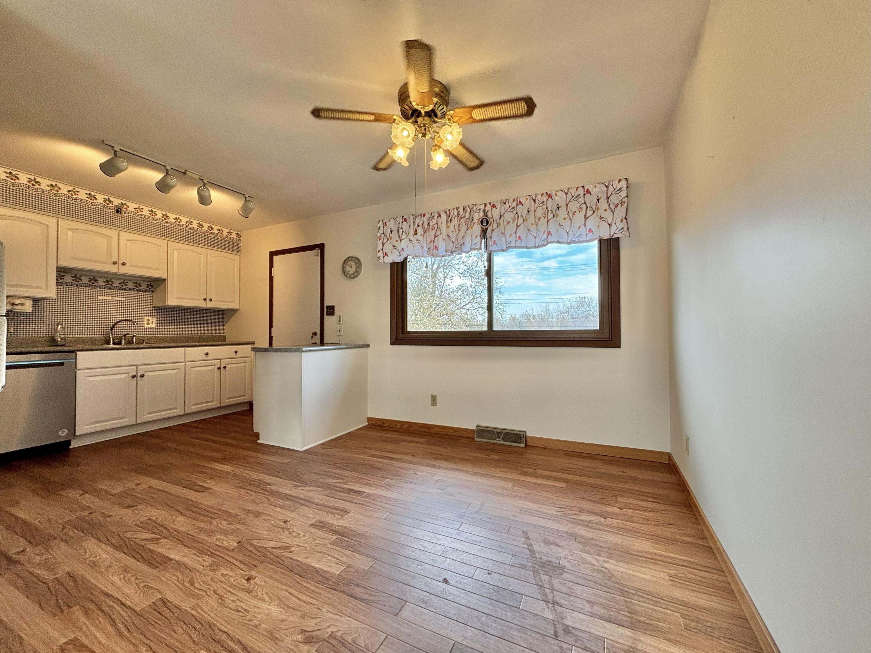 5361 Pierce Street Merrillville, IN 46410 - Photo 5 of 21 a view of a kitchen with a sink cabinets and wooden floor