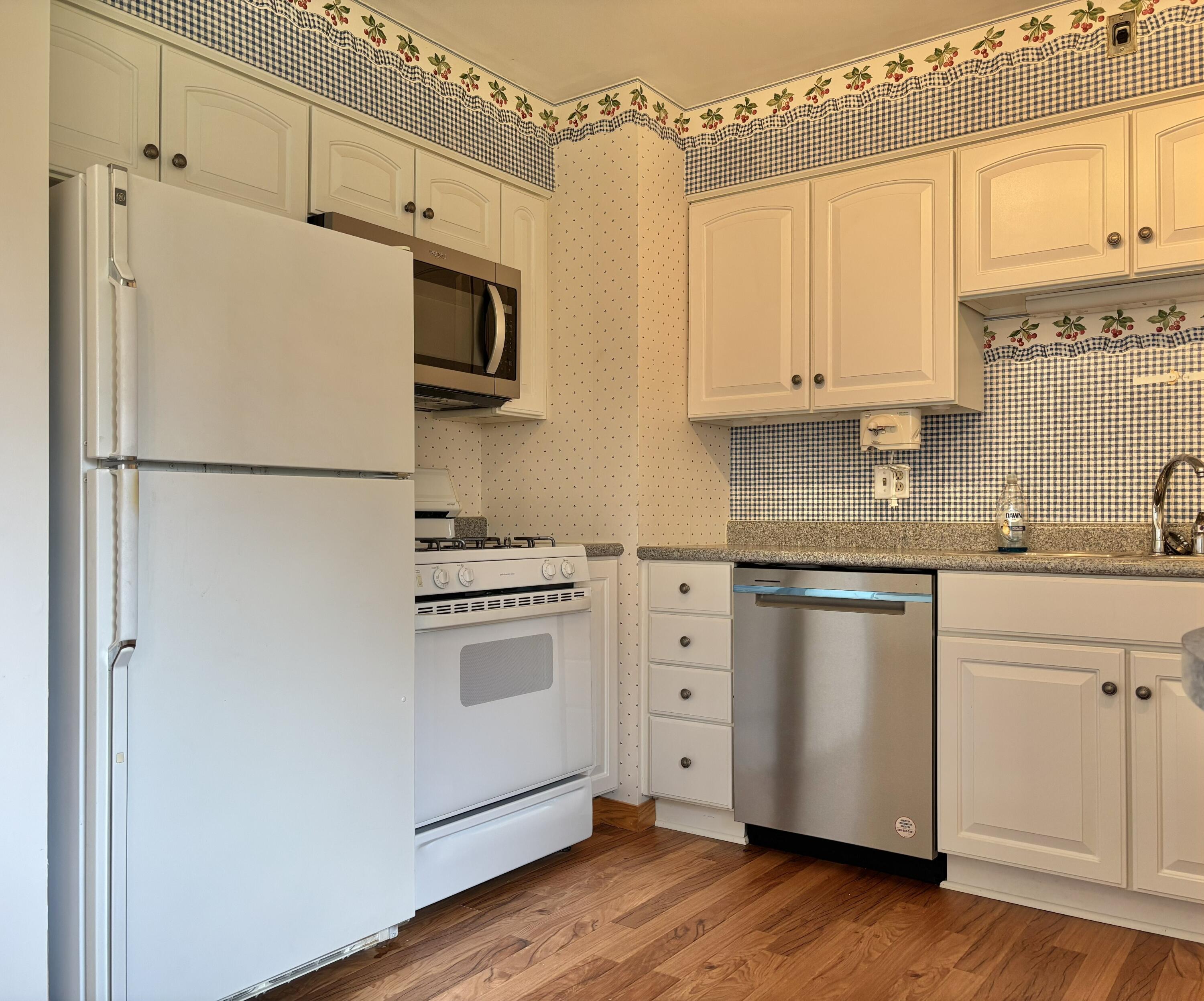 5361 Pierce Street Merrillville, IN 46410 - Photo 7 of 21 a white refrigerator freezer sitting inside of a kitchen