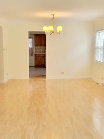a view of empty room with a bathroom