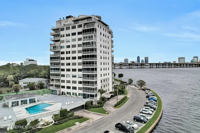 a view of a swimming pool with sitting area