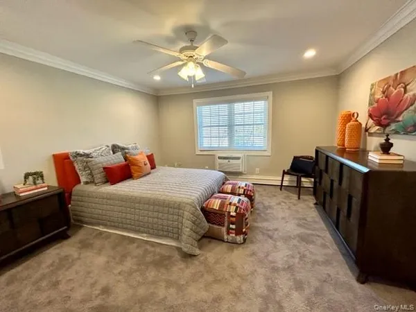 a bed room with a bed and a chandelier