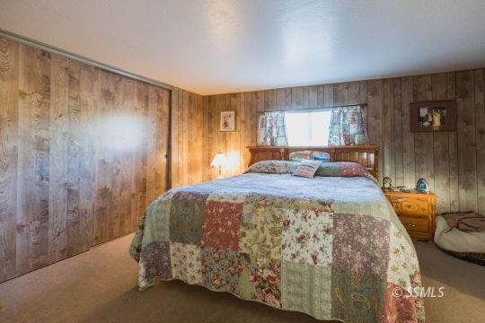 716 West Reeves Avenue Ridgecrest, CA 93555 - Photo 21 of 28 a bedroom with a bed and a window