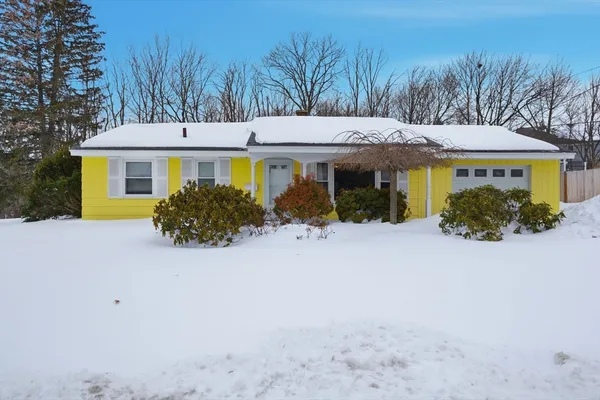 front view of a house with a yard
