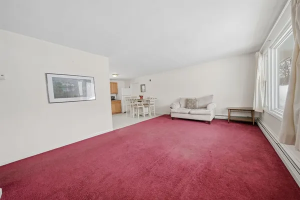 a room with furniture and a rug