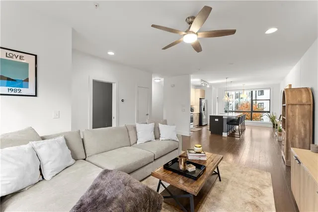 a large kitchen with a table and chairs