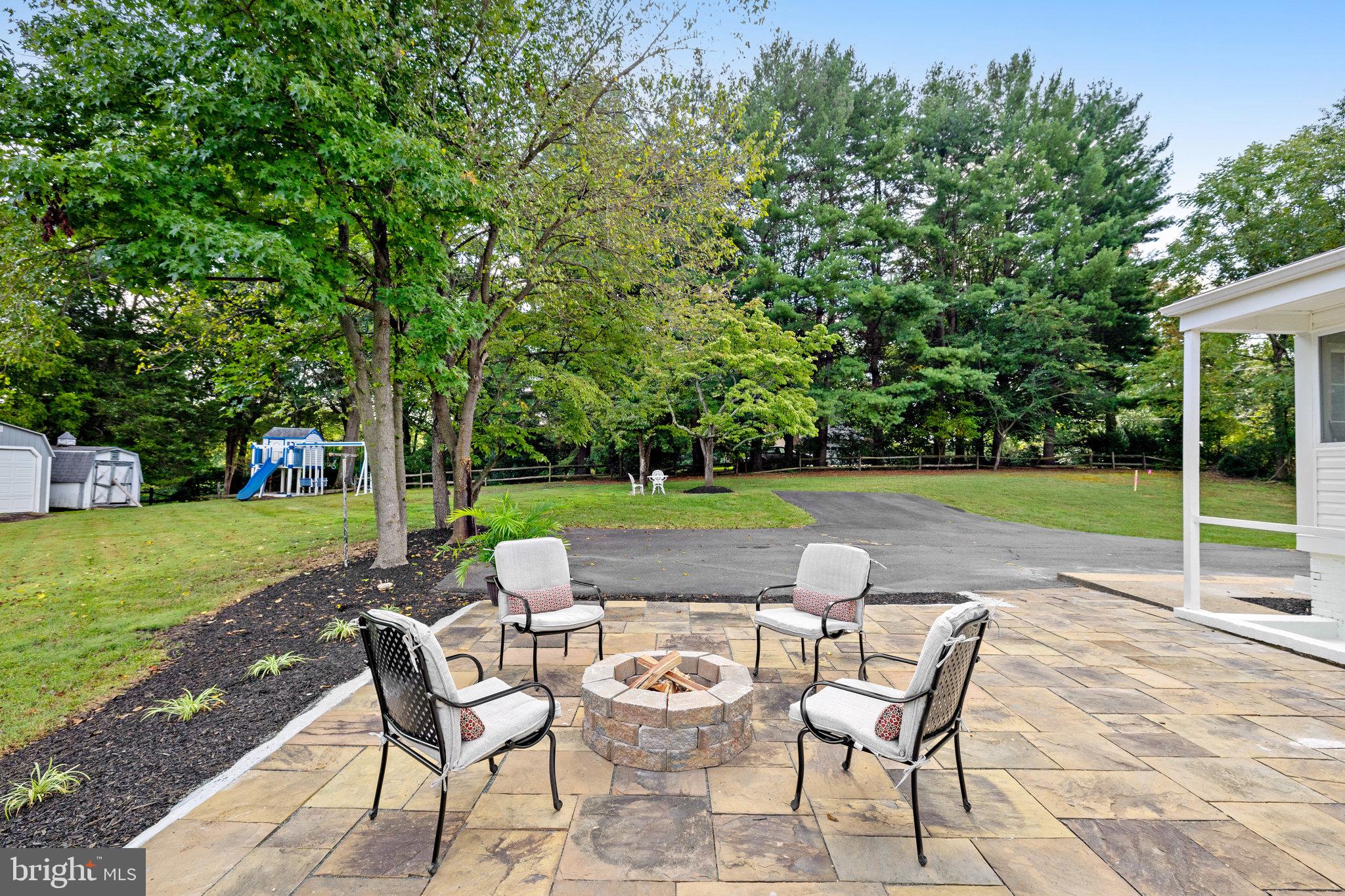 11410 Waples Mill Road Oakton, VA 22124 - Photo 53 of 62 Inviting fire pit in a serene garden.