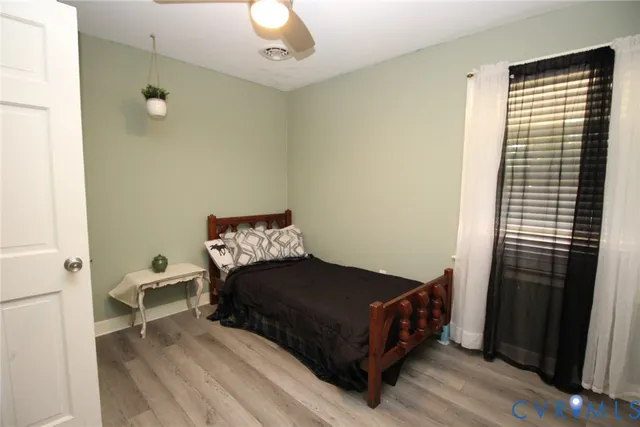 a bedroom with a bed and a mirror