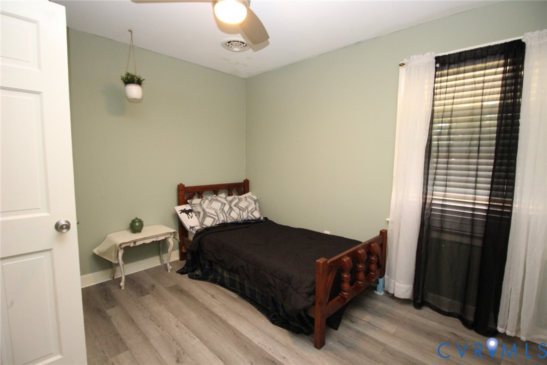 207 Chiappa Road Sandston, VA 23150 - Photo 16 of 25 Bedroom featuring light wood-style floors and a ce