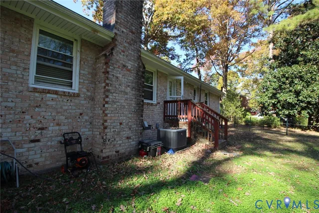 a backyard of a house with barbeque oven