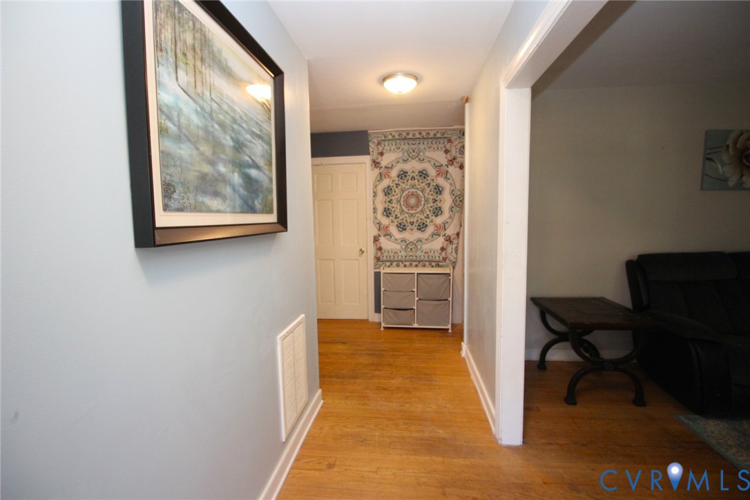 207 Chiappa Road Sandston, VA 23150 - Photo 3 of 25 Corridor featuring light wood-style flooring and b