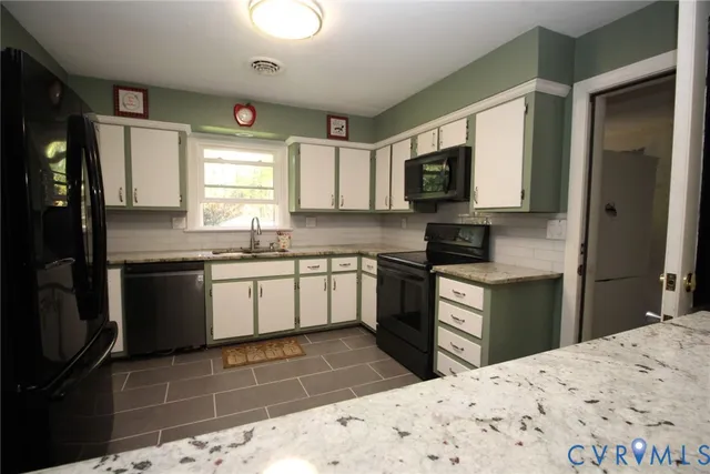a kitchen with a sink stove and refrigerator