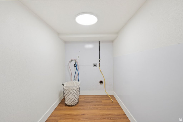 673 East 700 South Springville, UT 84663 - Photo 36 of 43 Dedicated laundry area featuring wood-finish flooring, white walls, and a ceiling-mounted light fixture