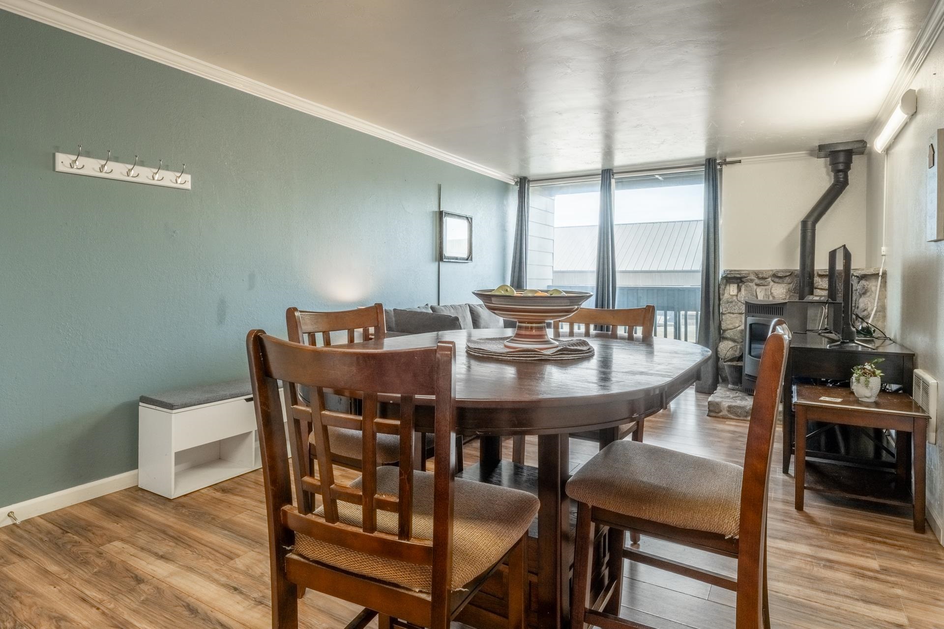 137 Laurel Mountain Road, Unit 312 Mammoth Lakes, CA 93546 - Photo 6 of 37 a view of a dining room with furniture and wooden floor