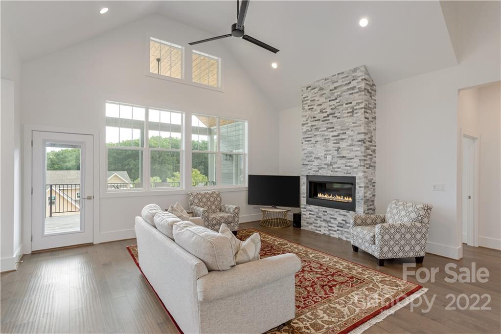 112 Meadow Breeze Road Arden, NC 28704 - Photo 17 of 44 a living room with furniture and a fireplace