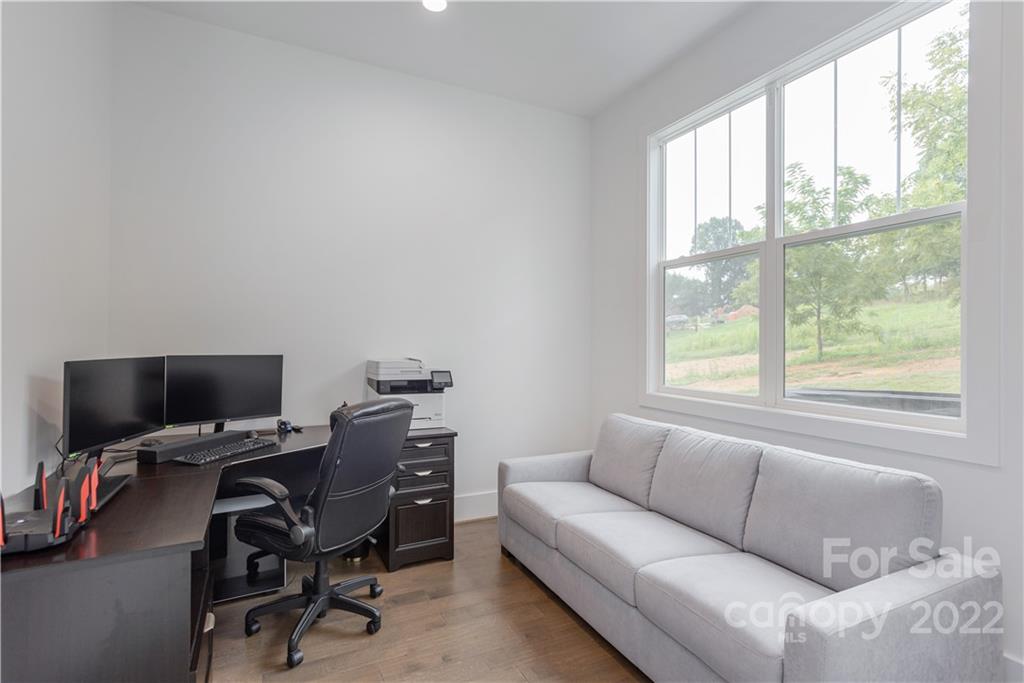 112 Meadow Breeze Road Arden, NC 28704 - Photo 25 of 44 a livingroom with workspace and a window
