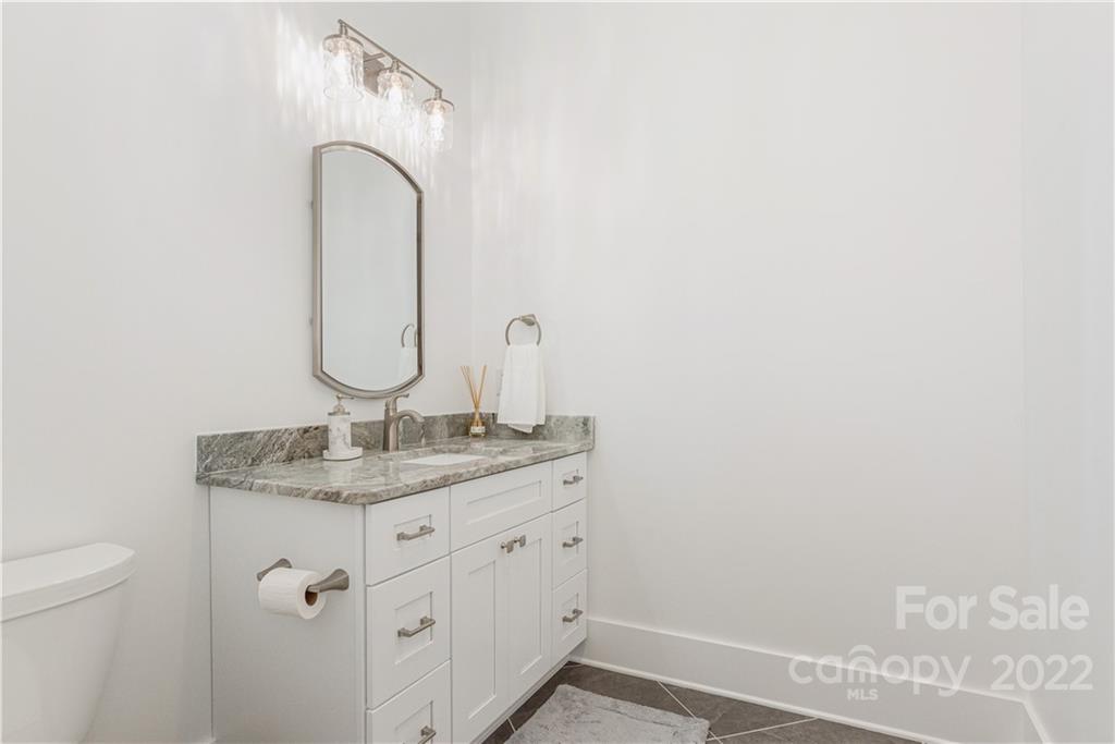 112 Meadow Breeze Road Arden, NC 28704 - Photo 26 of 44 a bathroom with a granite countertop sink and a mirror