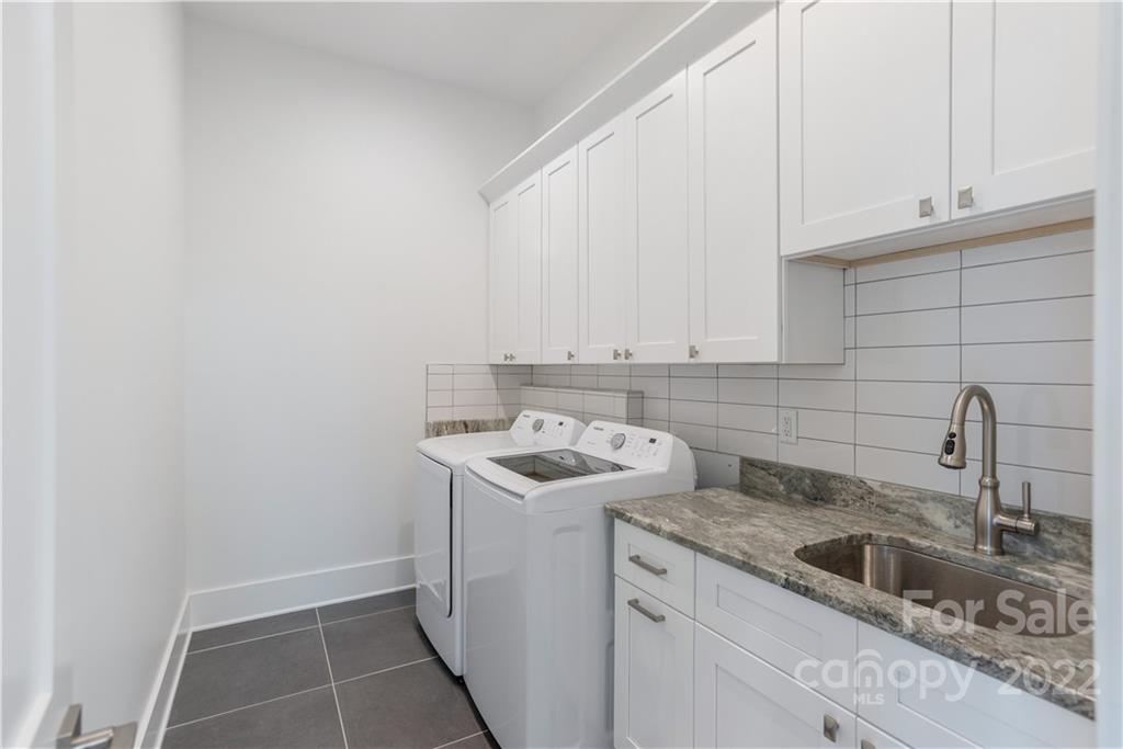 112 Meadow Breeze Road Arden, NC 28704 - Photo 27 of 44 a kitchen with a sink and cabinets