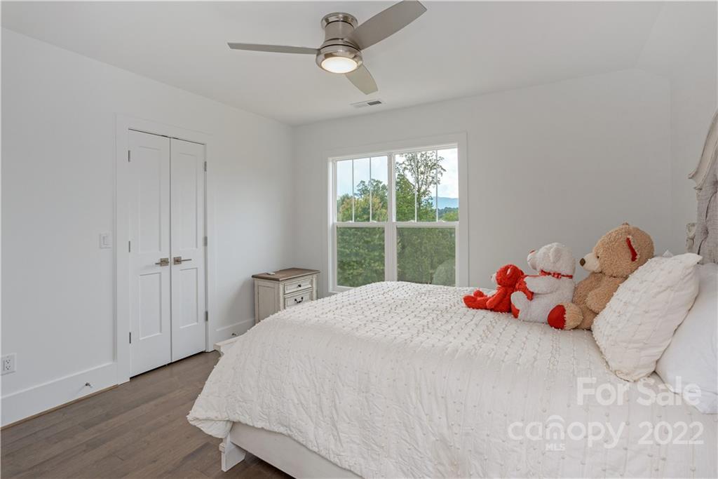 112 Meadow Breeze Road Arden, NC 28704 - Photo 31 of 44 a bedroom with a bed and a window