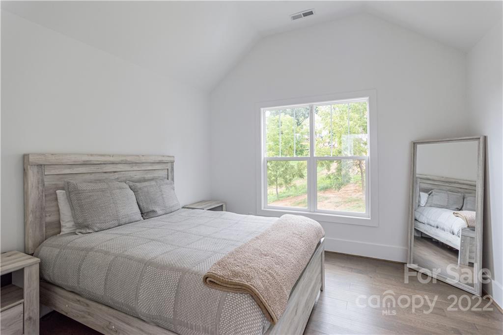 112 Meadow Breeze Road Arden, NC 28704 - Photo 32 of 44 a bedroom with a bed and window