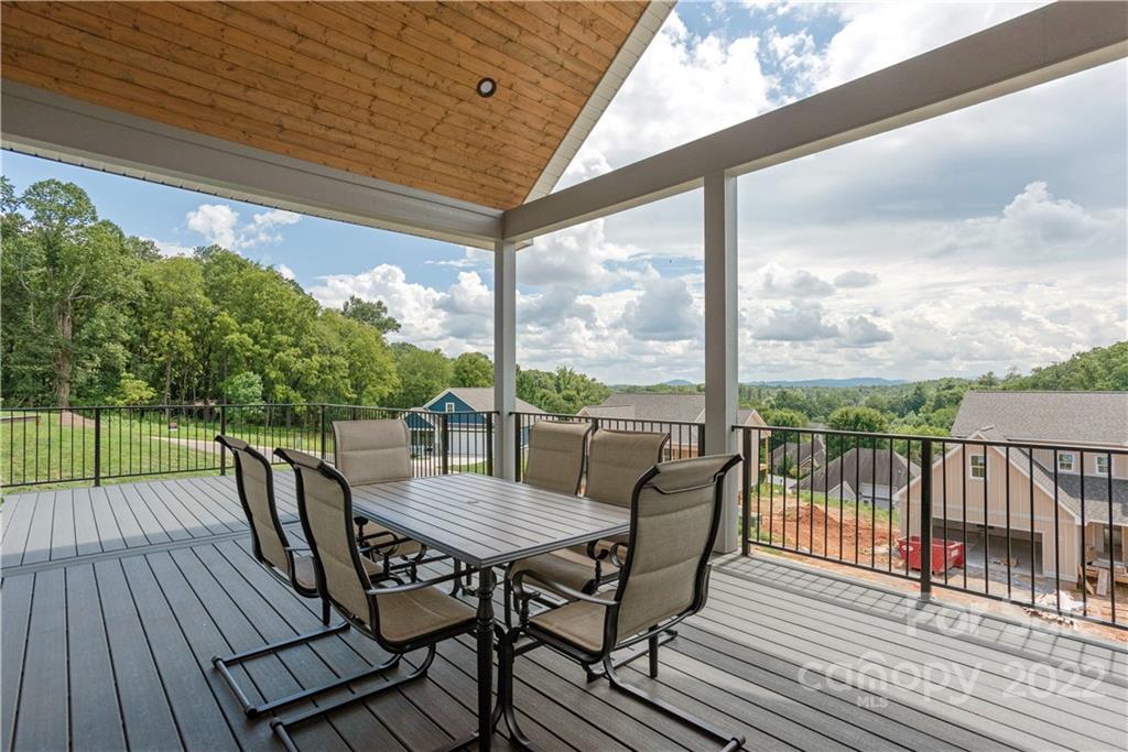 112 Meadow Breeze Road Arden, NC 28704 - Photo 35 of 44 a view of a balcony with furniture and wooden floor