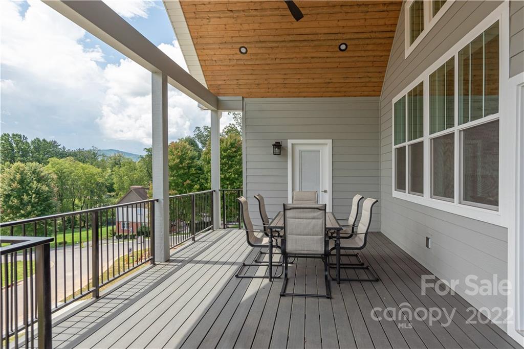 112 Meadow Breeze Road Arden, NC 28704 - Photo 37 of 44 a view of a chairs on the roof deck