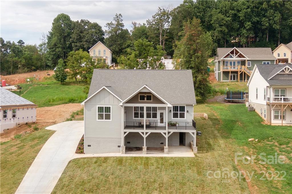 112 Meadow Breeze Road Arden, NC 28704 - Photo 39 of 44 a front view of a house with garden