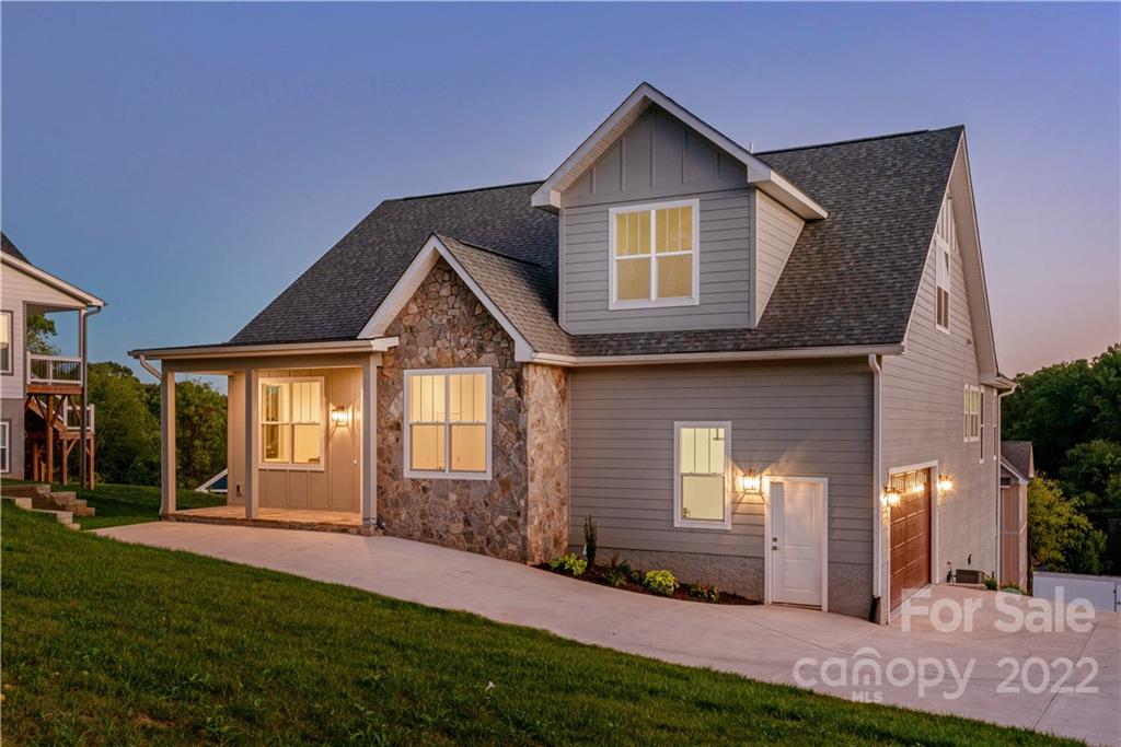 112 Meadow Breeze Road Arden, NC 28704 - Photo 4 of 44 a front view of a house with a yard and garage