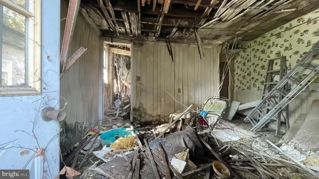 a kitchen with a refrigerator and a stove
