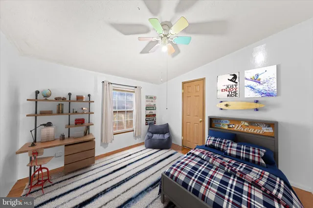 a bedroom with furniture and a window