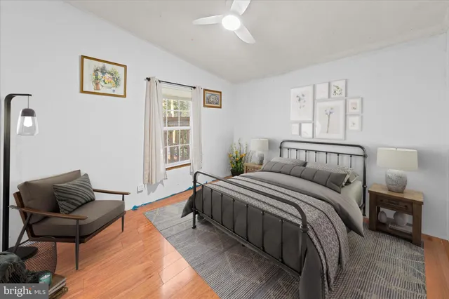 a bedroom with a bed and a couch