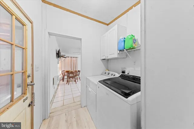 a kitchen with a sink and a stove top oven