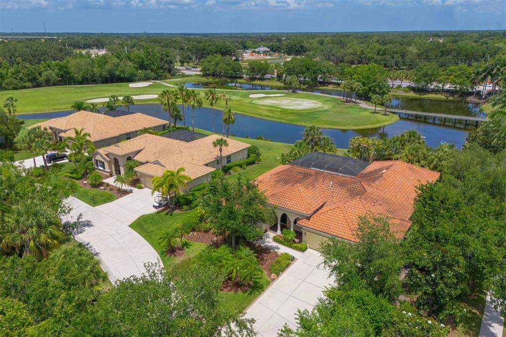 10622 Conch Shell Terrace Bradenton, FL 34212 - Photo 54 of 69 an aerial view of a house with yard and lake view