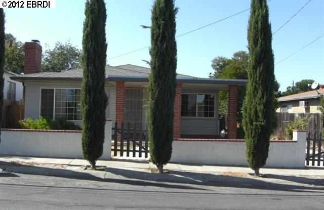 a view of a brick house with a large windows