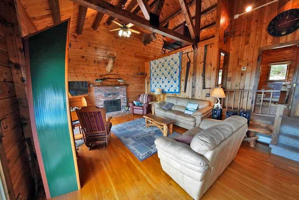 1058 Highway 1 Weston, ME 04424 - Photo 19 of 94 living-room-fireplace-slide