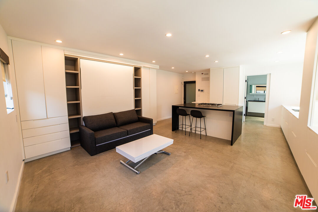 14 Brooks Avenue, Unit 8 Venice, CA 90291 - Photo 2 of 13 a living room with furniture and a kitchen