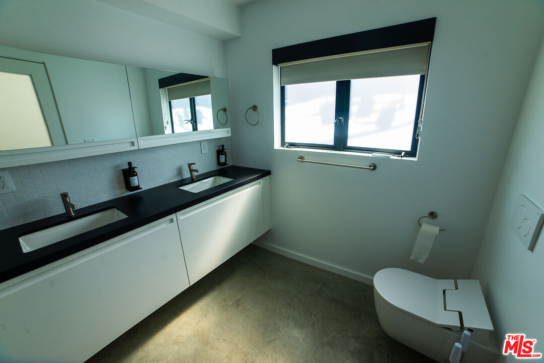 14 Brooks Avenue, Unit 8 Venice, CA 90291 - Photo 4 of 13 a kitchen with a sink cabinets and a window