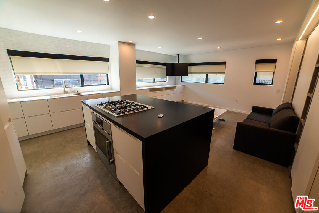 14 Brooks Avenue, Unit 8 Venice, CA 90291 - Photo 6 of 13 a kitchen that has a sink and a stove in it