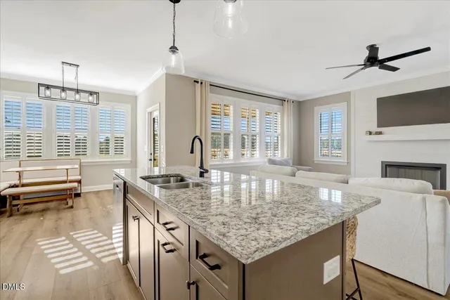 a kitchen with stainless steel appliances granite countertop a stove and a microwave