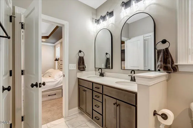 a bedroom with a bed and a ceiling fan