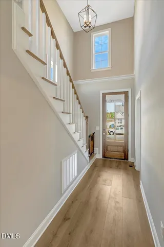 a bedroom with a bed and a ceiling fan