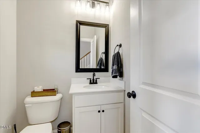 a view of walk in closet with clothes