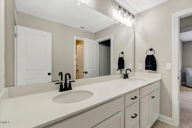 a living room with furniture and a ceiling fan