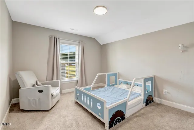 a bedroom with a bed and furniture