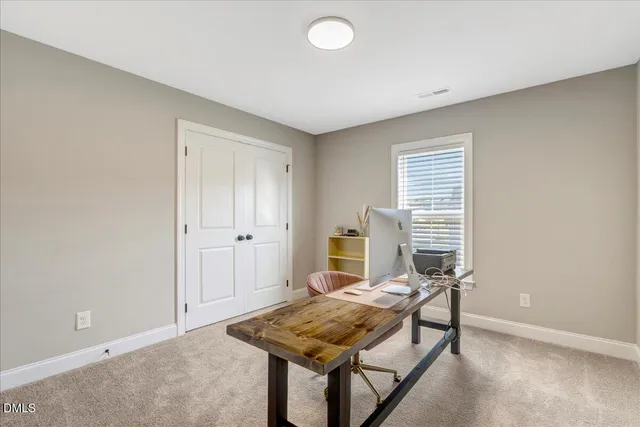 a bedroom with a bed and a mirror