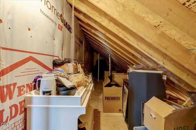 a view of a room with furniture and window