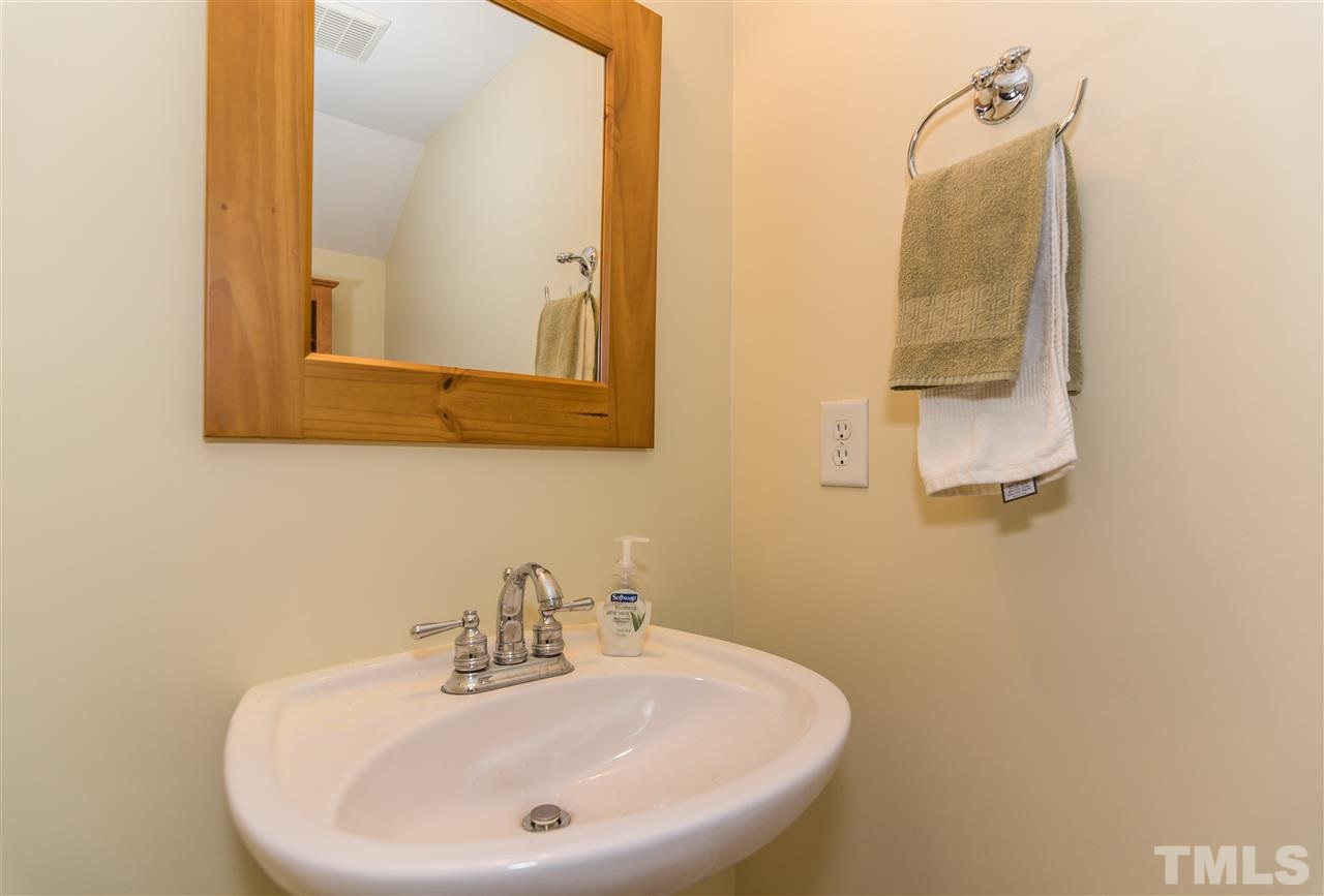 2220 Bellaire Avenue, Unit 2 Raleigh, NC 27608 - Photo 14 of 23 a bathroom with a sink and a mirror
