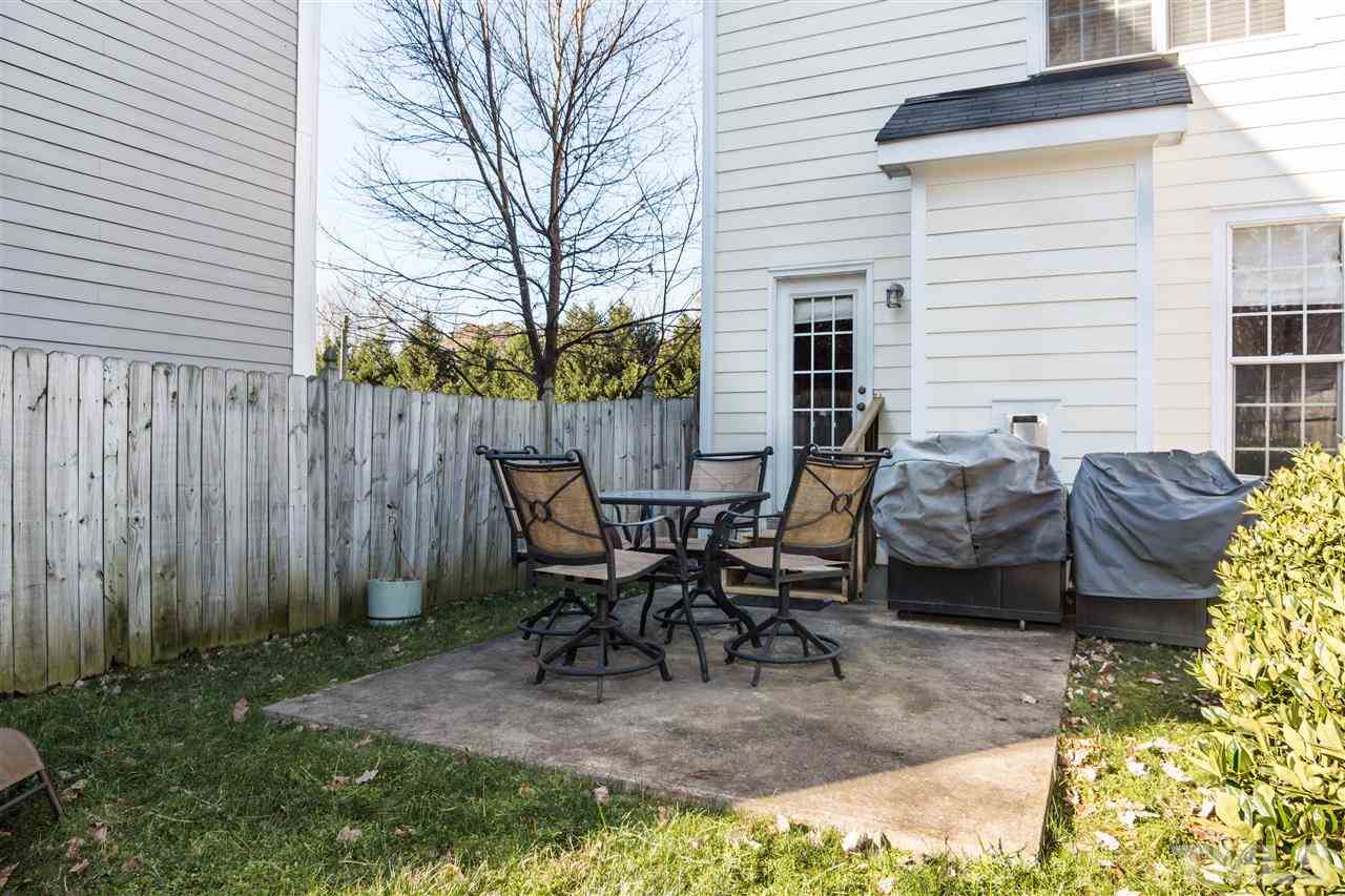 2220 Bellaire Avenue, Unit 2 Raleigh, NC 27608 - Photo 22 of 23 a view of a backyard with table and chairs
